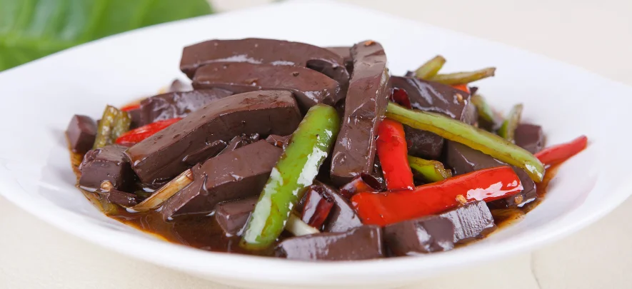 9. Xiang Cai Chao Ya Xue (Stir-Fried Duck Blood with Pickled Vegetables)